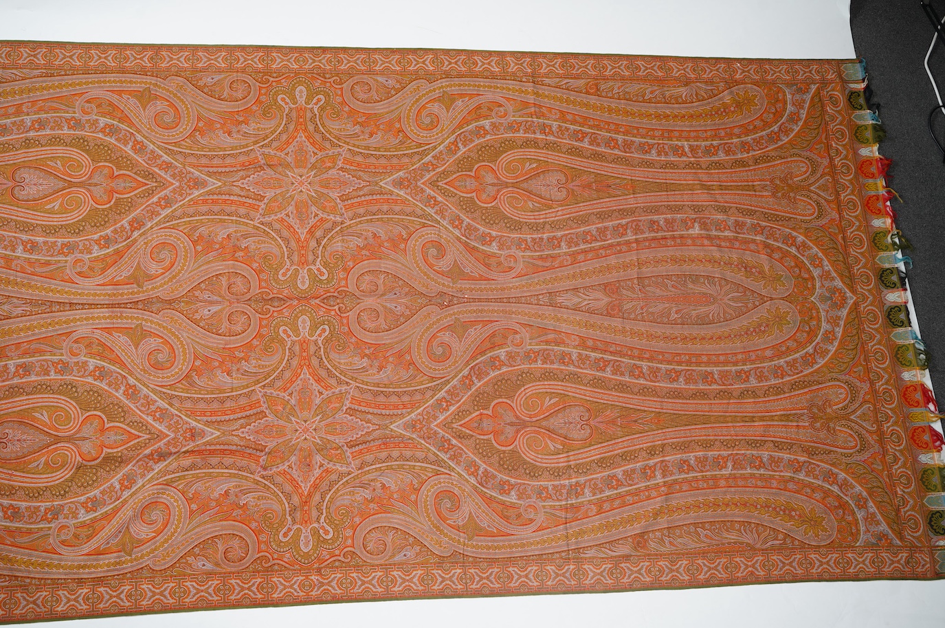 A French possibly Lyon, 19th century ornate silk and fine wool woven Paisley patterned shawl. Woven in polychromes coloured silks and wools on a jacquard loom, using an array of punch cards to create this elaborate desig